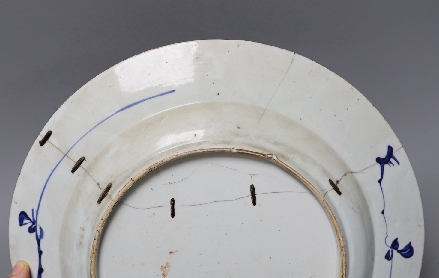 Three Chinese export blue and white dishes, 18th/19th century, largest 42cms wide